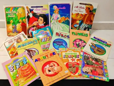 a pile of childrens books sitting on a table at GOLDEN HOUSE ,1min to aeon, 7min to zoo,8min to lake gardens in Taiping