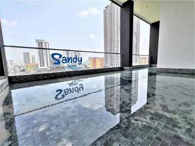 a balcony with a swimming pool in a building at SoftGrey 2 Rooms Apartment, 4 plus 2 Pax at Urban Suites in Jelutong