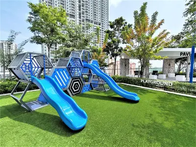 a playground in a park with a blue slide at SoftGrey 2 Rooms Apartment, 4 plus 2 Pax at Urban Suites in Jelutong
