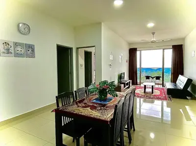 a dining room with a table and chairs and a living room at Ammara Homestay 2 Palas Horizon Kea Farm in Cameron Highlands