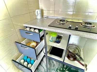 a miniature kitchen with a counter and a counter top at Ammara Homestay 2 Palas Horizon Kea Farm in Cameron Highlands