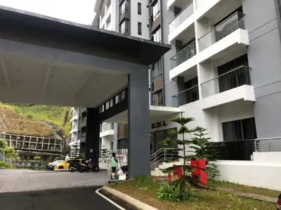 a person standing in front of a building at Ammara Homestay 2 Palas Horizon Kea Farm in Cameron Highlands