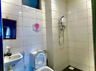a bathroom with a toilet and a sink at Ammara Homestay 2 Palas Horizon Kea Farm in Cameron Highlands