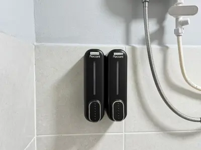 two black toothbrushes sitting on a counter in a bathroom at KB Penang Guest House1-8pax in Kepala Batas