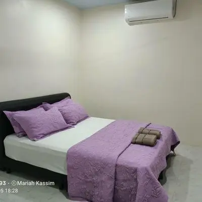 a rendering of a bed with purple blankets and pillows at MKF Homestay Padang Stang, Gerik in Gerik