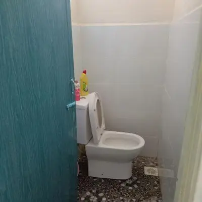 a bathroom with a white toilet in a room at MKF Homestay Padang Stang, Gerik in Gerik