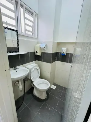 a bathroom with a toilet and a sink at AYAAN SYMPHONY INN Budget Homestay with Free WiFi and Netflix in Tanah Rata