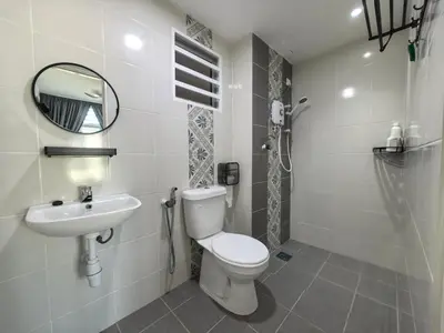 a bathroom with a toilet and a sink at Ipoh Town 2224 six pax By Hopestay in Ipoh