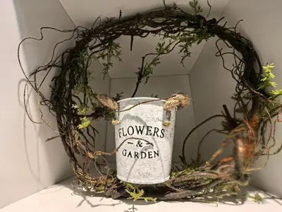 a wreath with a flower garden sign in front of a mirror at Ipoh Town 2224 six pax By Hopestay in Ipoh