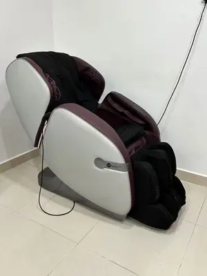 a chair sitting on the floor next to a wall at \u5bb6\u5bb6\u6c11\u5bbf in Nibung Tebal