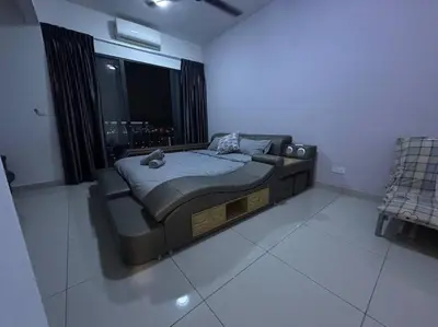 a bedroom with a bed and a large window at SweeT Homestay in Perai