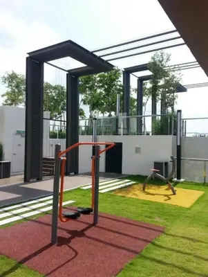 a playground in a park with a building at SweeT Homestay in Perai