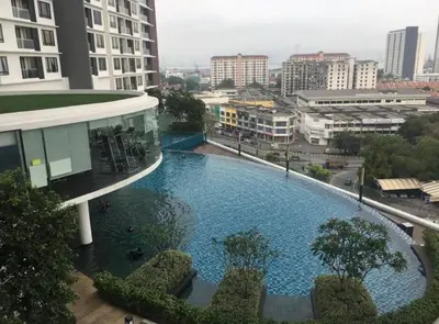a large swimming pool in the middle of a city at SweeT Homestay in Perai