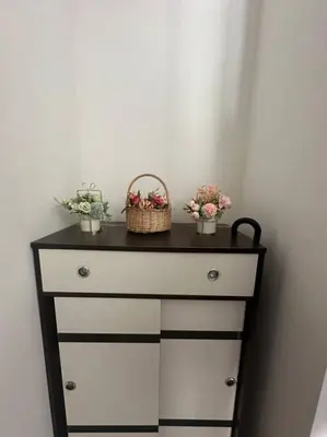 a dresser with two baskets on top of it at SweeT Homestay in Perai