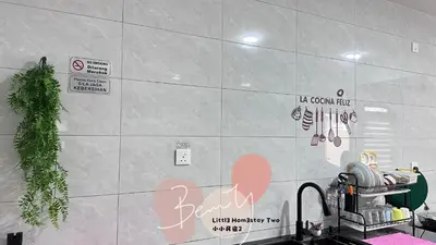 a kitchen with a wall with signs on it at Little Homestay Two - \u5c0f\u5c0f\u6c11\u5bbf2 in Ipoh