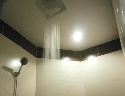 a bathroom with a shower with a shower curtain at Hotel Kawan in Tapah