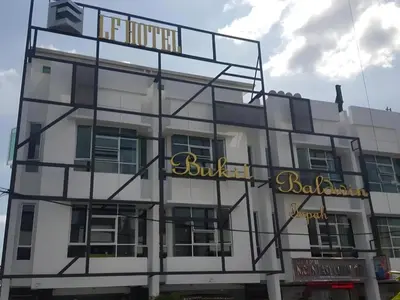 a building with a sign on the side of it at LF Hotel Tapah in Tapah