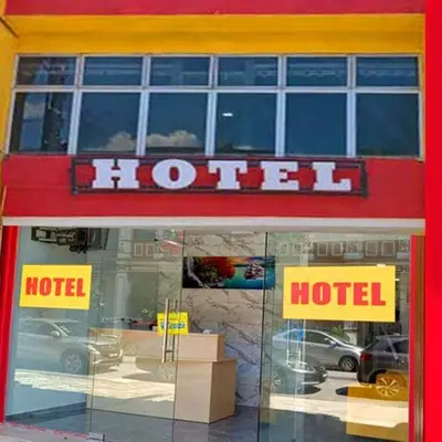 a hotel sign on the front of a building at GEORGETOWN @ NEW WAVE HOTEL in George Town