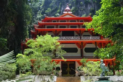 a large building with a statue in front of it at Mornington Hotel Soon Choon Ipoh in Kampong Sengat