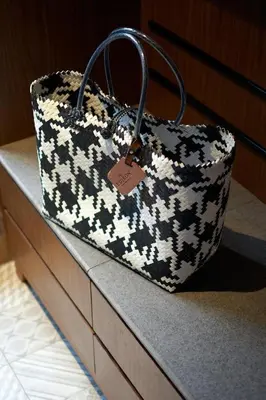 a black and white purse sitting on top of a counter at The Edison George Town in George Town