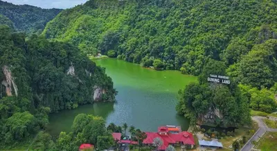 an aerial view of a lake with a house in the middle at WW Hotel Ipoh in Ipoh