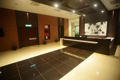 a lobby with a waiting room with a mirror at Star-Well hotel in Kuala Lipis