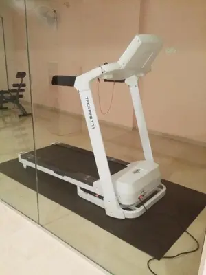 a white exercise bike on display in a room at KTC HOTEL in Bidur