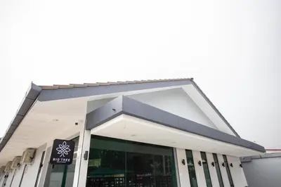 a large white building with a large window at Big Tree Boutique in Ipoh