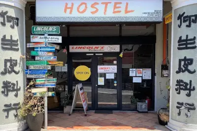 a hospital with signs in front of a building at SPOT ON 90194 Lincoln's Backpacker's in George Town