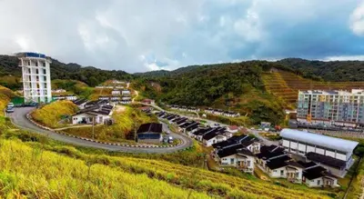 a small town on a hill with a winding road at OYO 90722 D'puncak Hotel Cameron Highlands in Cameron Highlands