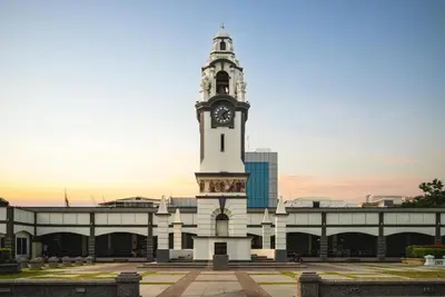 a building with a clock tower on top of it at OYO 90936 Hotel Manjoi Inn Ipoh in Jelapang