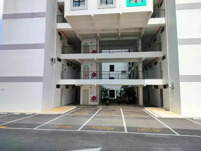 an empty parking lot in an apartment building at IFS SoHo Basic Homestay Entire Home in Seri Iskandar