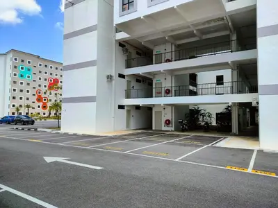 an empty parking lot in front of a building at IFS SoHo Basic Homestay Entire Home in Seri Iskandar