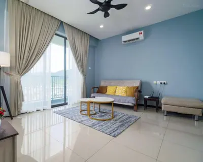 a living room with a couch and a table at 3 Bedroom Izz Homestay Casa kayangan in Ipoh