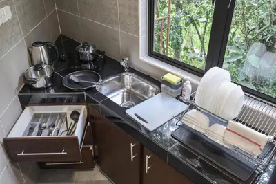 a kitchen counter with a sink and a sink at Cameron Highland Retreat in Tanah Rata