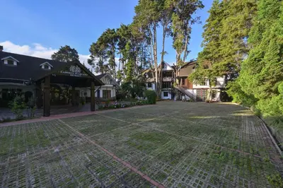 an empty driveway in front of a house at Cameron Highland Retreat in Tanah Rata