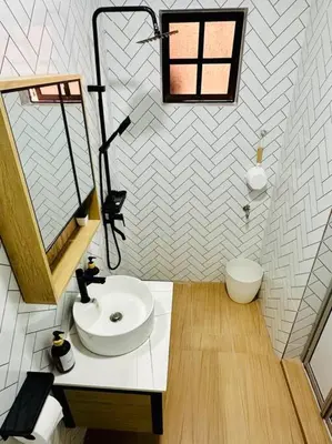 a bathroom with a sink and a toilet at My Muji Homestay I Massage Chair I Wifi 500 Mbps in Seri Manjung