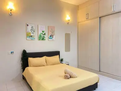 a bedroom with a bed with a stuffed animal on it at CozyHouse 4ROOM 3BATH ROOM 10PAX```SimpangAmpatTasek in Simpang Ampat