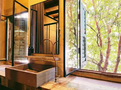 a bathroom with a sink in front of a window at Belakang Kong Heng Ipoh Hotel in Ipoh