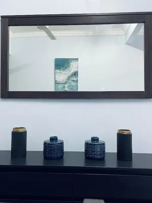 a black table with three candles on top of it at D Ocean Homestay in Seri Manjung