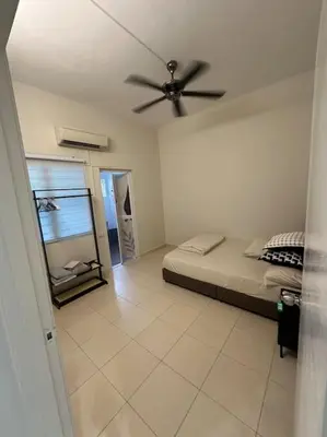 a bedroom with a bed and a ceiling fan at Raub Newly French Style Homestay\u52b3\u52ff\u5168\u65b0\u6c11\u5bbf-\u9760\u8fd1\u69b4\u83b2\u56ed in Raub