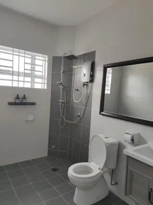 a bathroom with a shower and a toilet and a sink at Raub Newly French Style Homestay\u52b3\u52ff\u5168\u65b0\u6c11\u5bbf-\u9760\u8fd1\u69b4\u83b2\u56ed in Raub