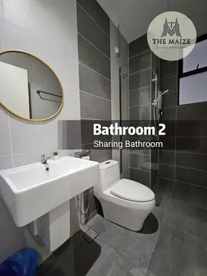a bathroom with a sink and a toilet and a mirror at The Cove Hillside Residence Ipoh - Downtown Delight in Ipoh