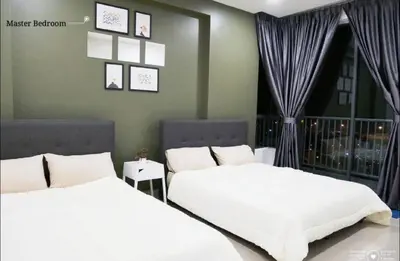 a bedroom with two beds and a window at Casa Kayangan Meru - Tulip by Goswell in Ipoh