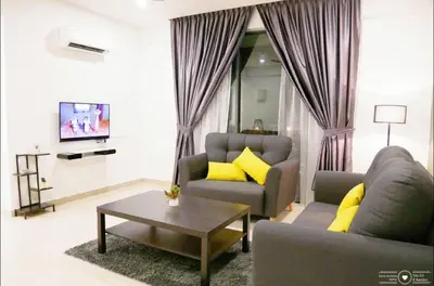 a living room with two couches and a coffee table at Casa Kayangan Meru - Tulip by Goswell in Ipoh