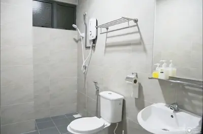 a bathroom with a toilet and a sink at Casa Kayangan Meru - Tulip by Goswell in Ipoh