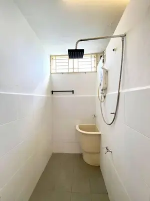 a small bathroom with a toilet and a window at Cozy House 3Room8Pax`````LUNAS in Lunas