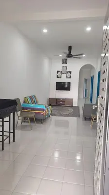a living room with a couch and a table at Homestay Manjung HZ in Sitiawan