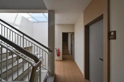 a hallway of a building with a fire hydrant at Simple Sanctuary Tanjung Tokong in Tanjung Bungah