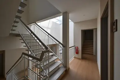 a spiral staircase in a building with a fire hydrant at Simple Sanctuary Tanjung Tokong in Tanjung Bungah